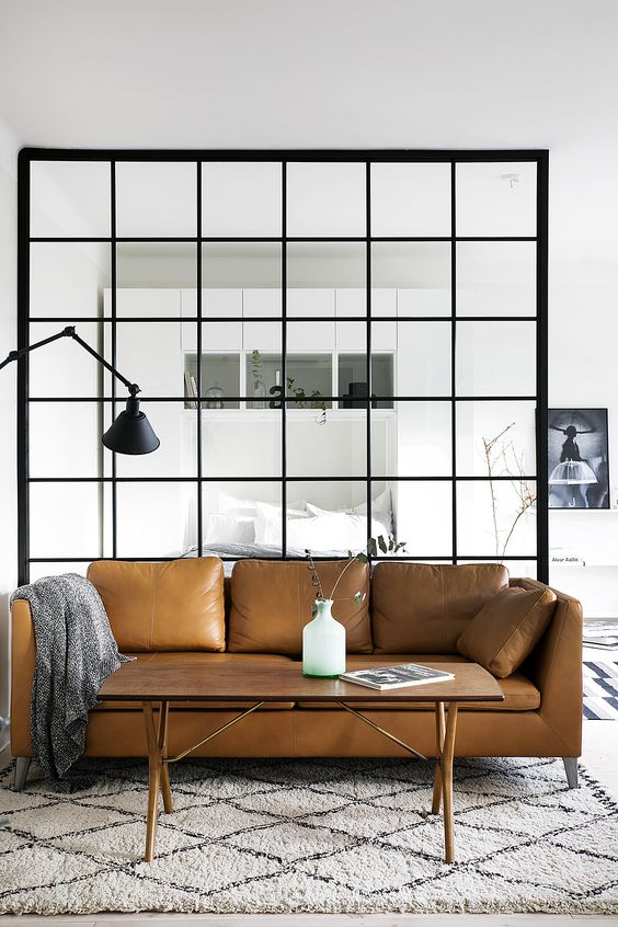 03-a-Stockholm-sofa-in-tan-leather-looks-ideal-in-a-light-filled-Scandinavian-space.jpg