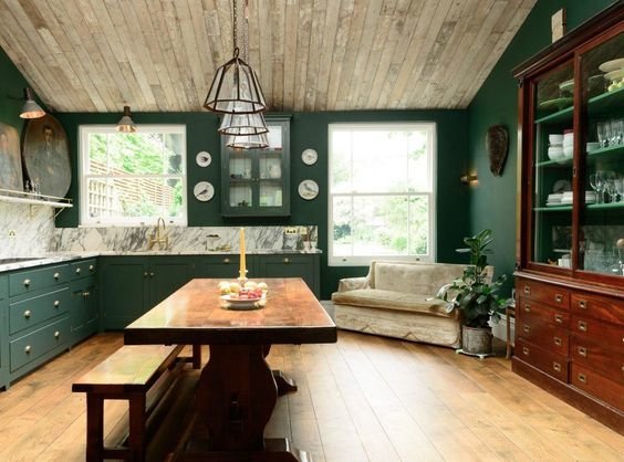 devol kitchens green with marble counters backsplash and a real furniture piece. Kitchen table in the kitchen instead of an island is interesting too. It feels more like a room than the standard kitchen.