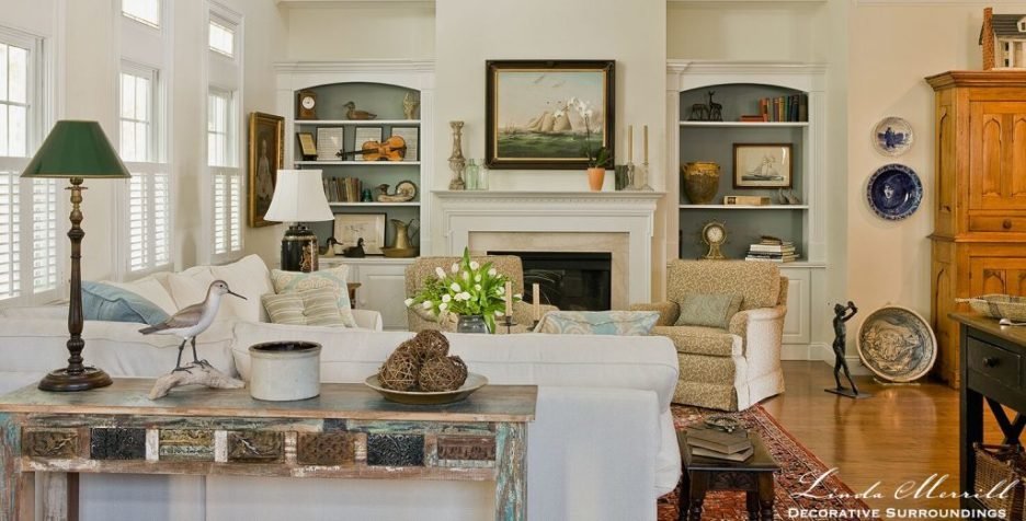 Design by Linda Merrill Decorative Surroundings: Coastal Home living room in Duxbury MA with white sectional arm chairs antiques
