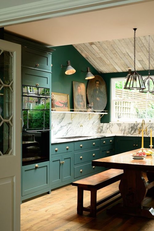 DeVol Kitchen design with fine art & hunter green cabinets.