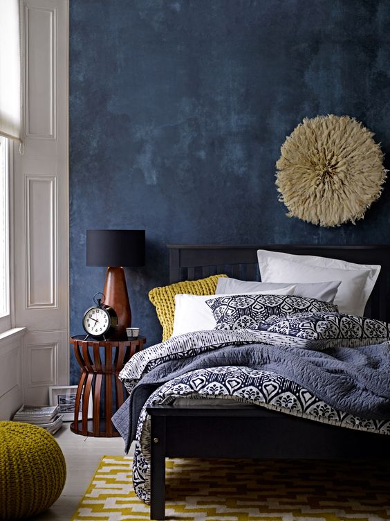 deep blue accent wall in modern eclectic bedroom - gorgeous use of color with wall and bedding: