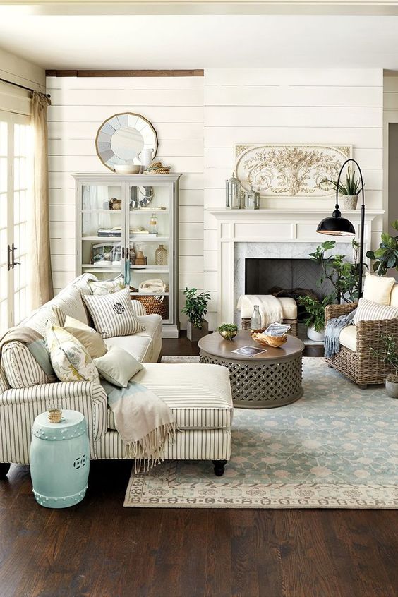 Elegant French Country Living Room.  I love the plaque above the mantle!  I have seen this plaque online at Ballards Designs.