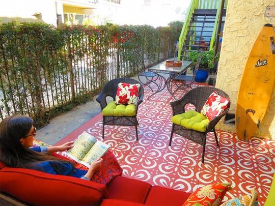 When cement tiles turned out too pricey for designers Karen and Guy Vidal at their East Hollywood apartment complex, they decided to create an outdoor carpet on a budget â using stencil and paint.