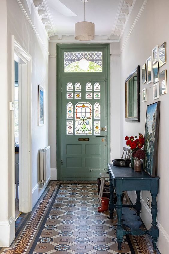 Small traditional entry of London home with slim console table and art work [From: Imperfect Interiors]