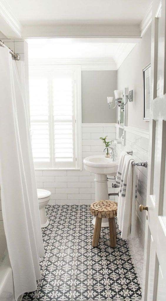 Tile design floor and white subway tile wall