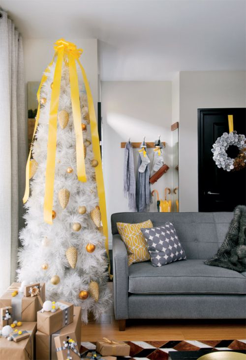a perfectly coordinated Christmas...yellow and grey...a different look but matches the home decor.....
