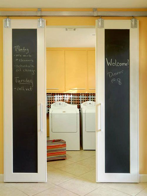 Laundry Room Ideas: These barn-style doors were painted with magnetic chalkboard paint for a customized way to close off the laundry room. Unique yet practical, this message center is a great way for a busy family to keep track of each other.