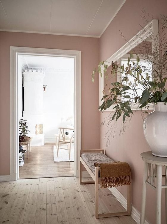 Beautiful pastel pink in entry way of Swedish apartment