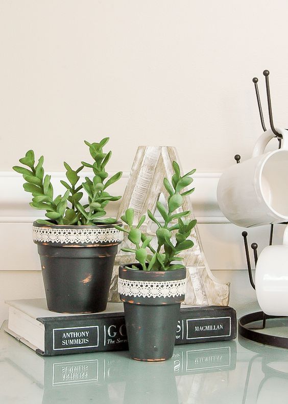 Create the perfect spring pots with these quick and affordable distressed Dollar Tree succulent pots.  www.littlehouseoffour.com
