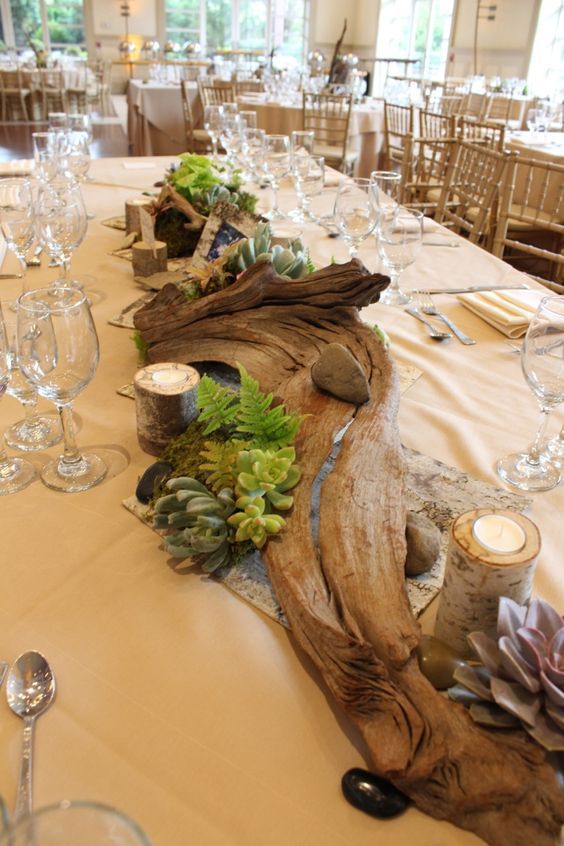 Tablescape featuring driftwood, ferns, succulents, birch candles, and other organic accents / http://www.deerpearlflowers.com/driftwood-wedding-decor-ideas/2/