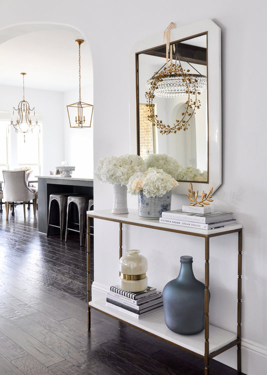 elegant white living room console with gold accents