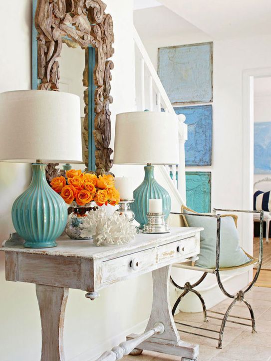 Lovely entry / foyer.  I like the mix of turquoise and blue accents with the aged wood details.
