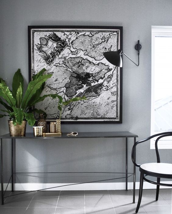 Love the colour combo: Grey walls, black and metallic extras and the greenery.