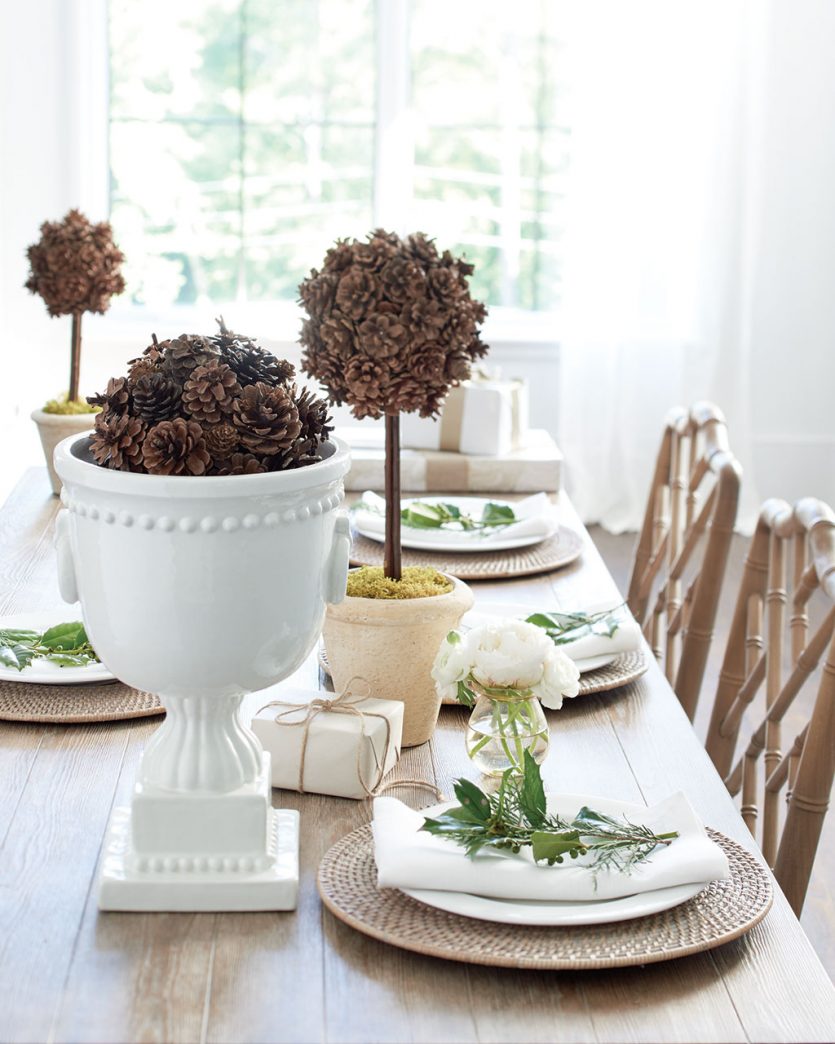 Pinecone topiaries on dining table as centerpiece